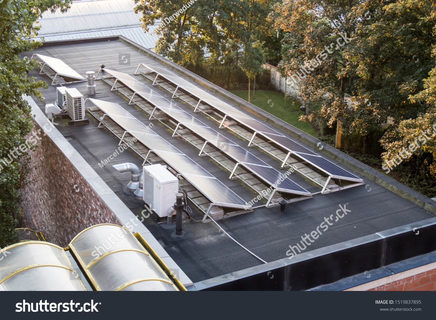 stock-photo-in-the-city-these-solar-panels-are-located-on-a-flat-roof-of-a-large-building-1519837895(1)(1)